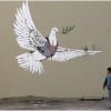 One of Banksy’s contribution to the wall dividing Israel and Palestine